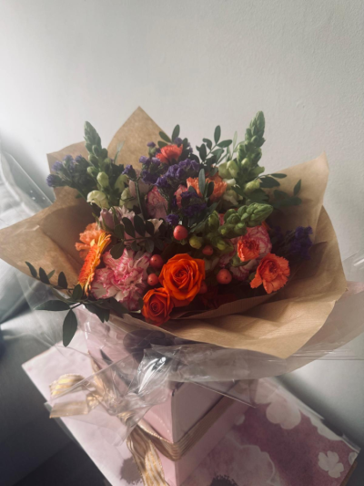 Autumn Sunset - A warm and vibrant bouquet inspired by the rich tones of a glowing sunset.