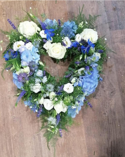 Blue Heart Tribute - Heart-shaped tribute designed in calming shades of blue, white, and soft lavender.